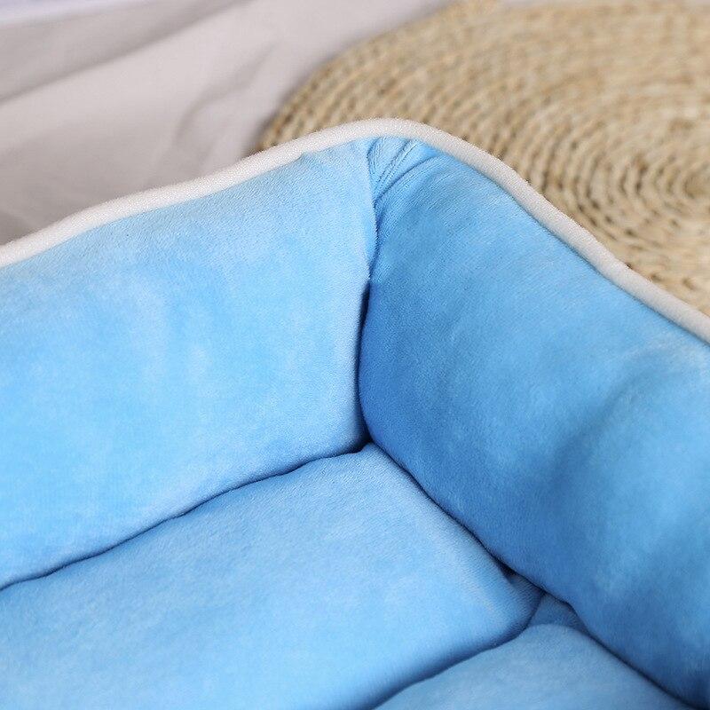 Non-slip pet dog bed in blue and pink, designed for comfort and warmth, suitable for dogs and cats.