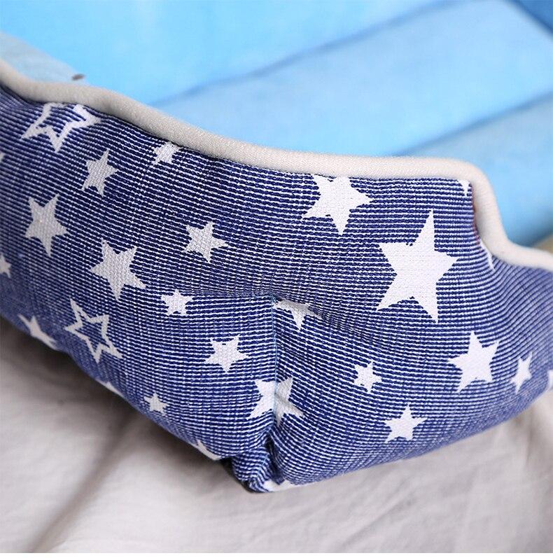 Non-slip pet dog bed in blue and pink, designed for comfort and warmth, suitable for dogs and cats.