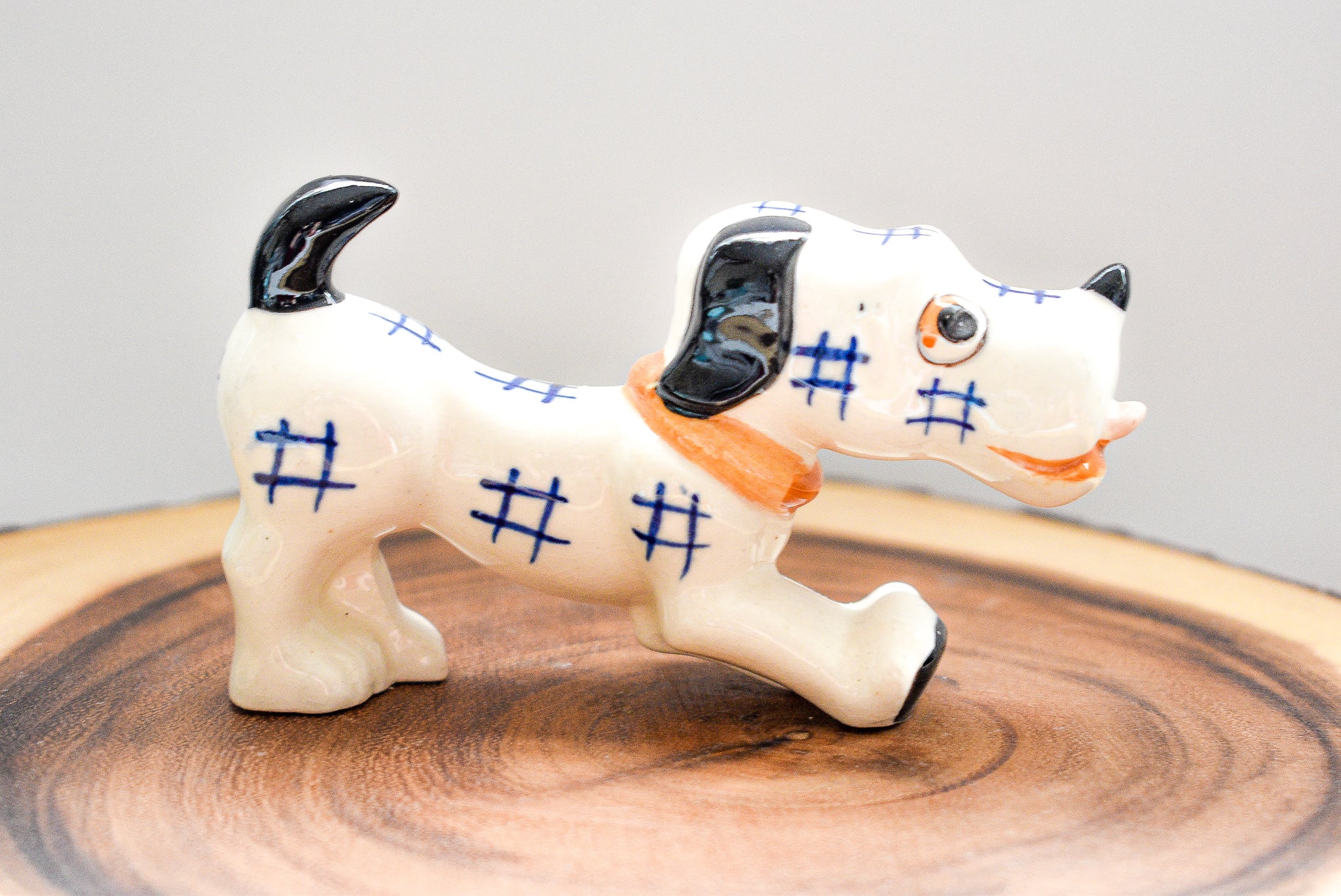 Occupied Japan Dachshund figurine, ceramic, 2.5 inches tall, 4.5 inches long, vintage collectible with light paint wear.