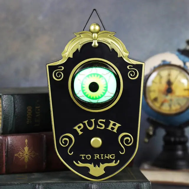 One-Eyed Glowing Halloween Doorbell Prop with eerie glow and spooky design, perfect for Halloween decorations.