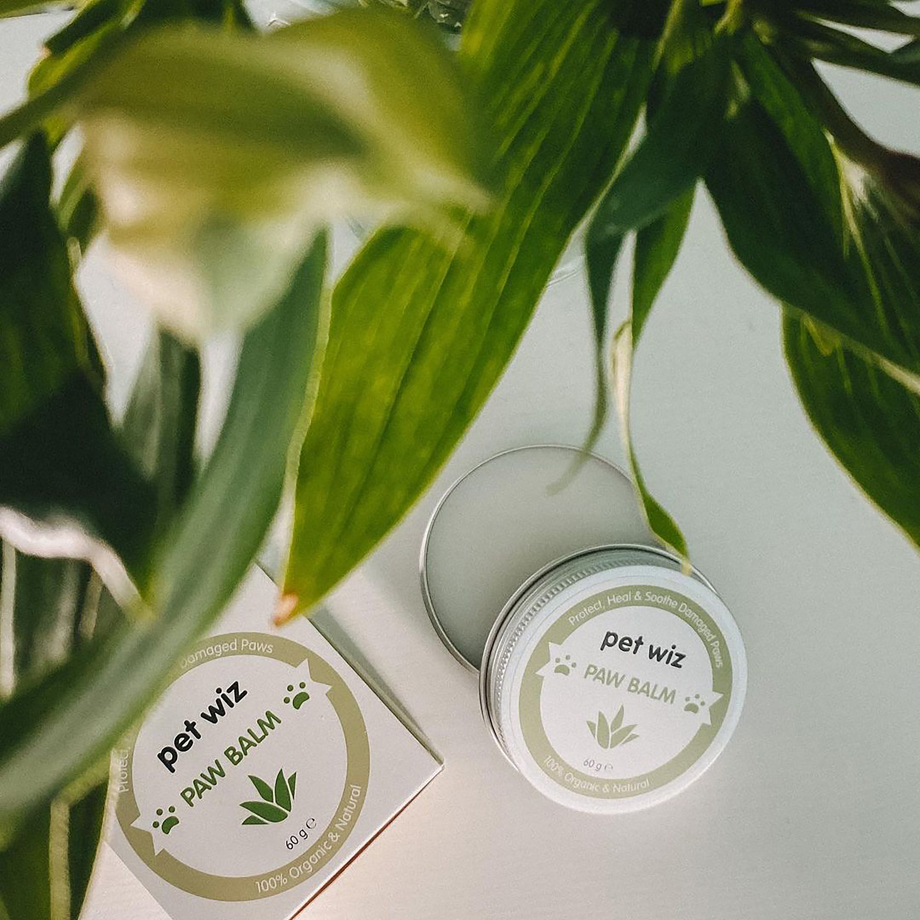 A jar of Organic Paw and Nose Balm for Dogs and Cats, showcasing its natural ingredients and soothing properties for pet care.