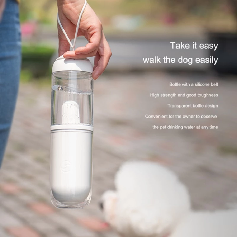 Outdoor Travel Pet Water Dispenser for dogs and cats, featuring a U-shaped trough and a silicone strap for easy carrying.