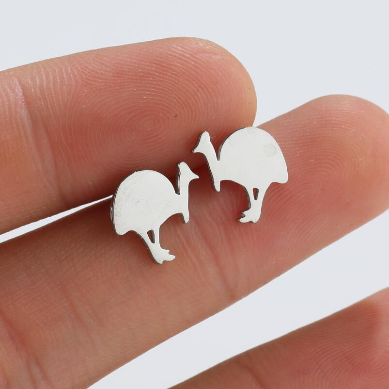 A pair of Pawsome Earrings featuring a unique art deco design made from gold filled, sterling silver, and stainless steel materials.