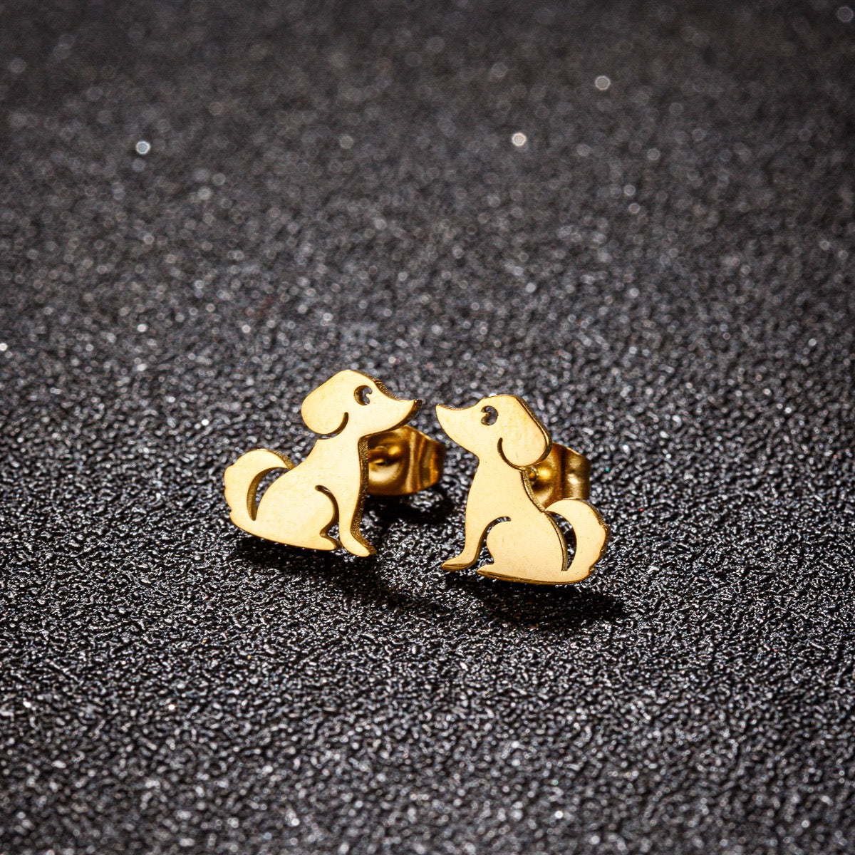 A pair of Pawsome Earrings featuring gold-filled and sterling silver materials in an elegant art deco design.