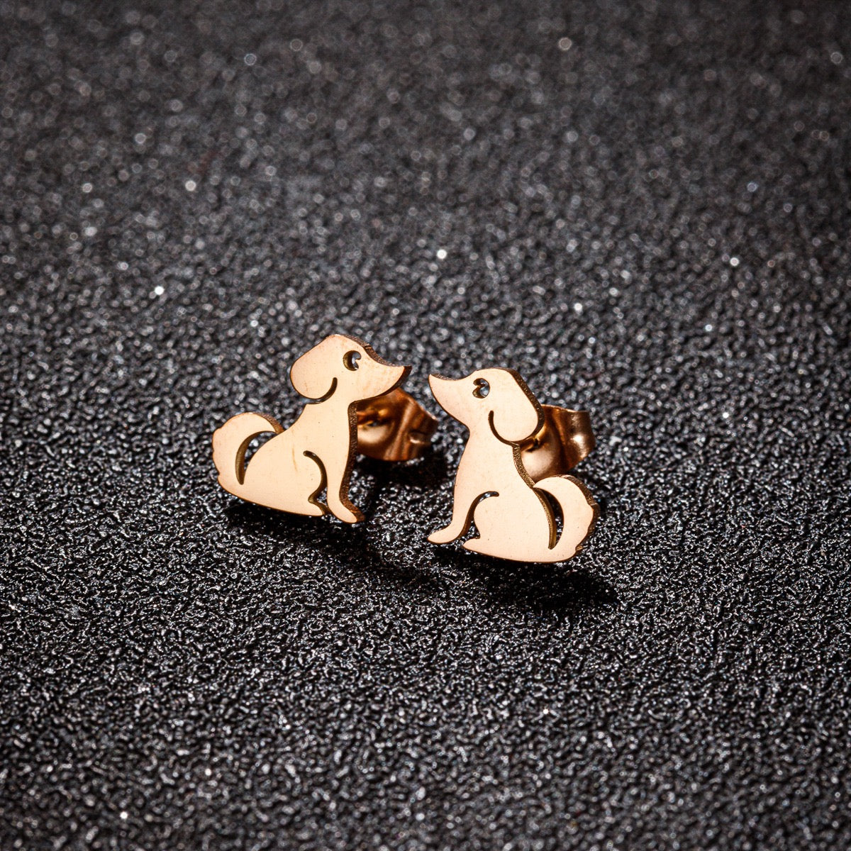 A pair of Pawsome Earrings featuring gold-filled and sterling silver materials in an elegant art deco design.