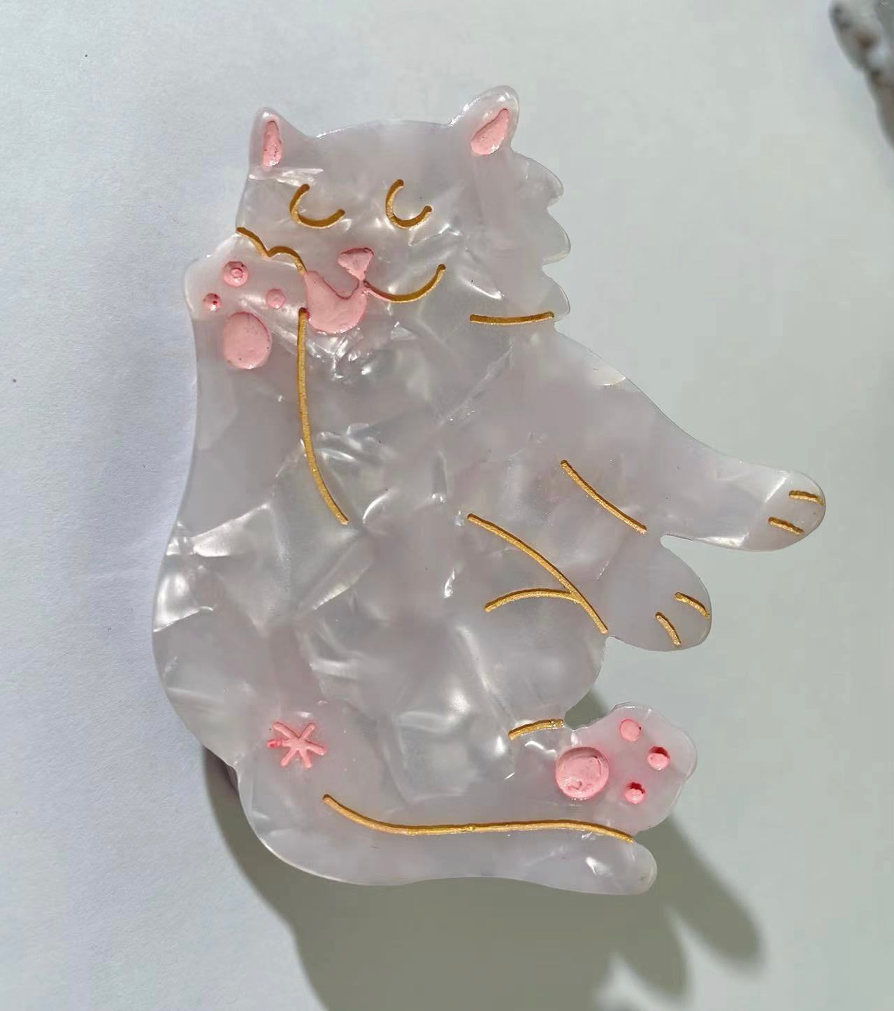 Hand-painted cat breed claw hair clip by PAWSOME PETS NEW YORK, showcasing vibrant colors and unique design, perfect for pet lovers.