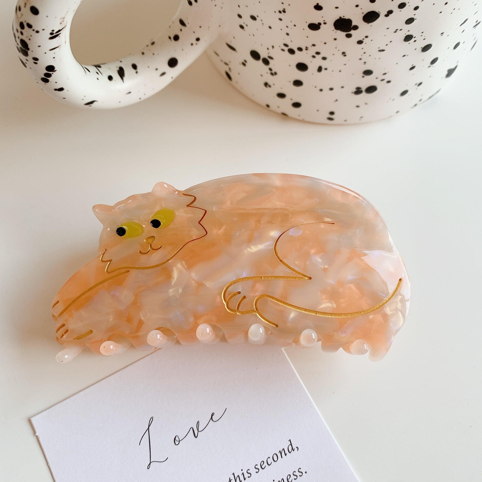 Hand-painted cat breed claw hair clip by PAWSOME PETS NEW YORK, showcasing intricate designs and eco-friendly materials.