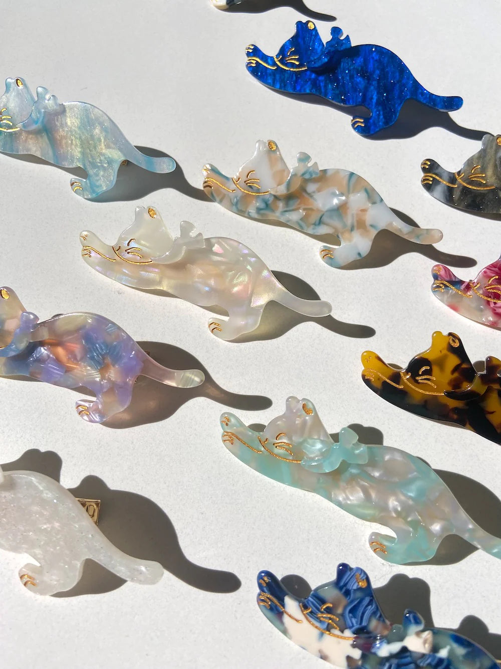 Hand-painted Pug breed claw hair clip by Pawsome Pets New York, showcasing vibrant colors and eco-friendly design.