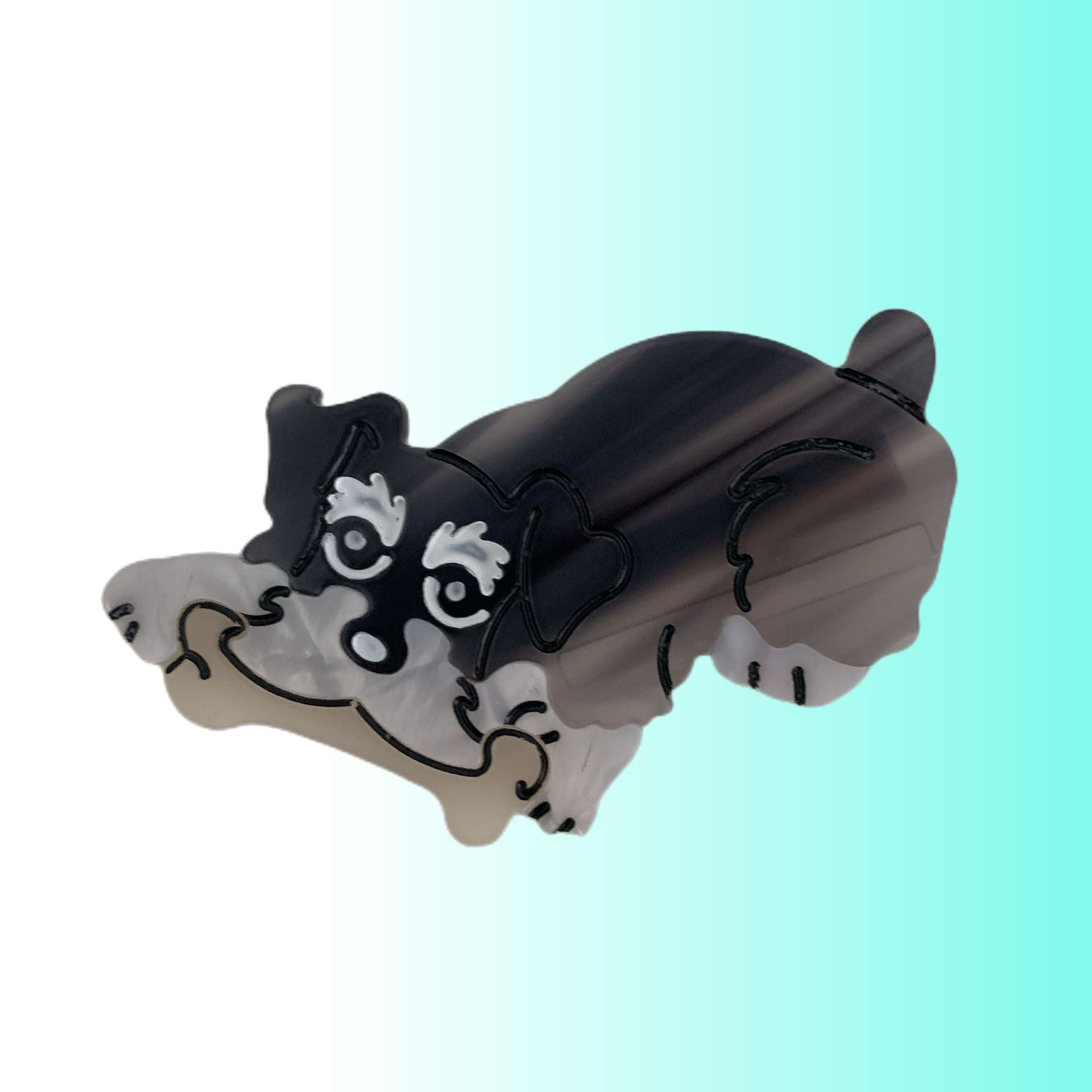 Hand-painted Pug claw hair clip by Pawsome Pets New York, showcasing eco-friendly design and double-sided craftsmanship.