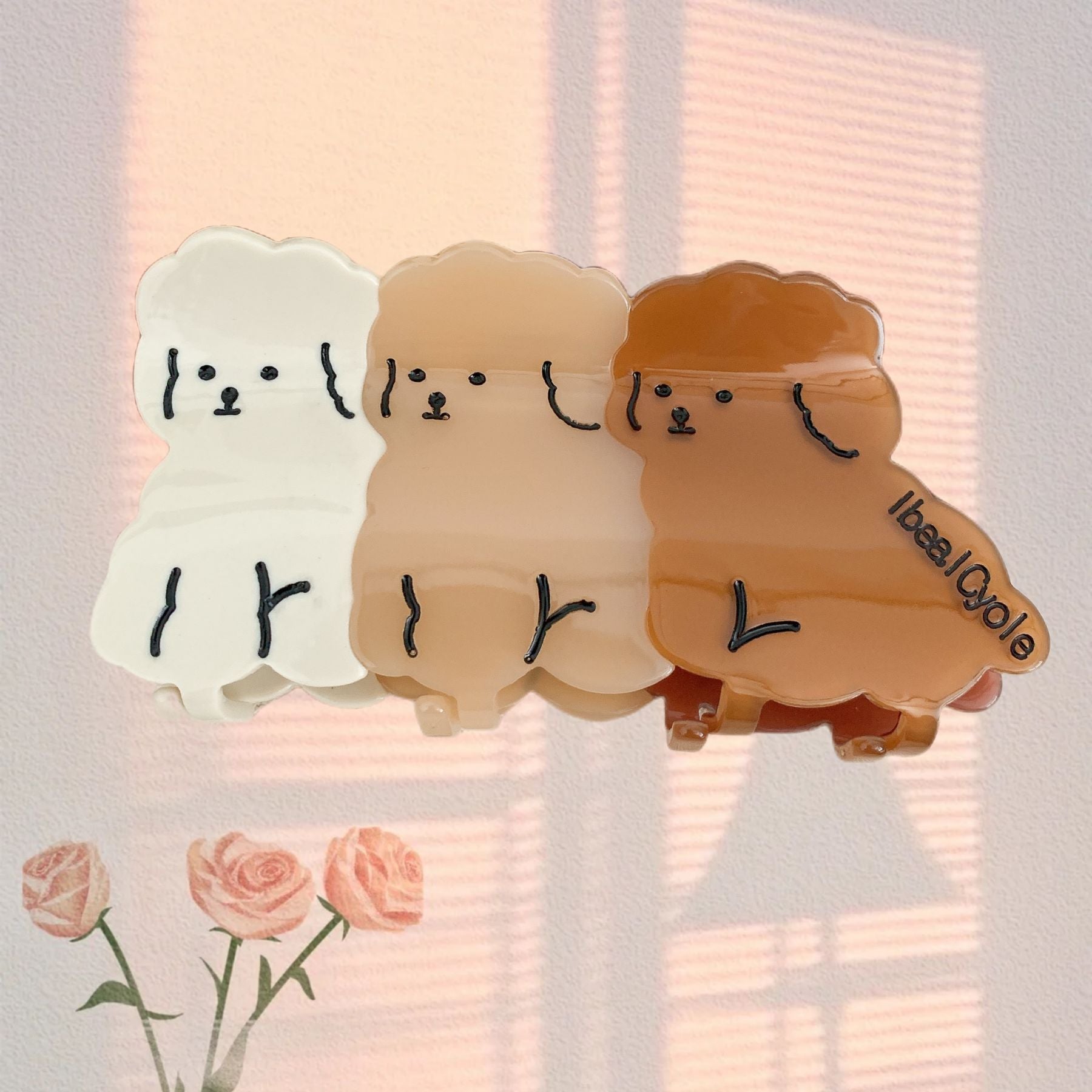 Hand-painted claw hair clip featuring a Pug design, made from eco-friendly cellulose acetate.