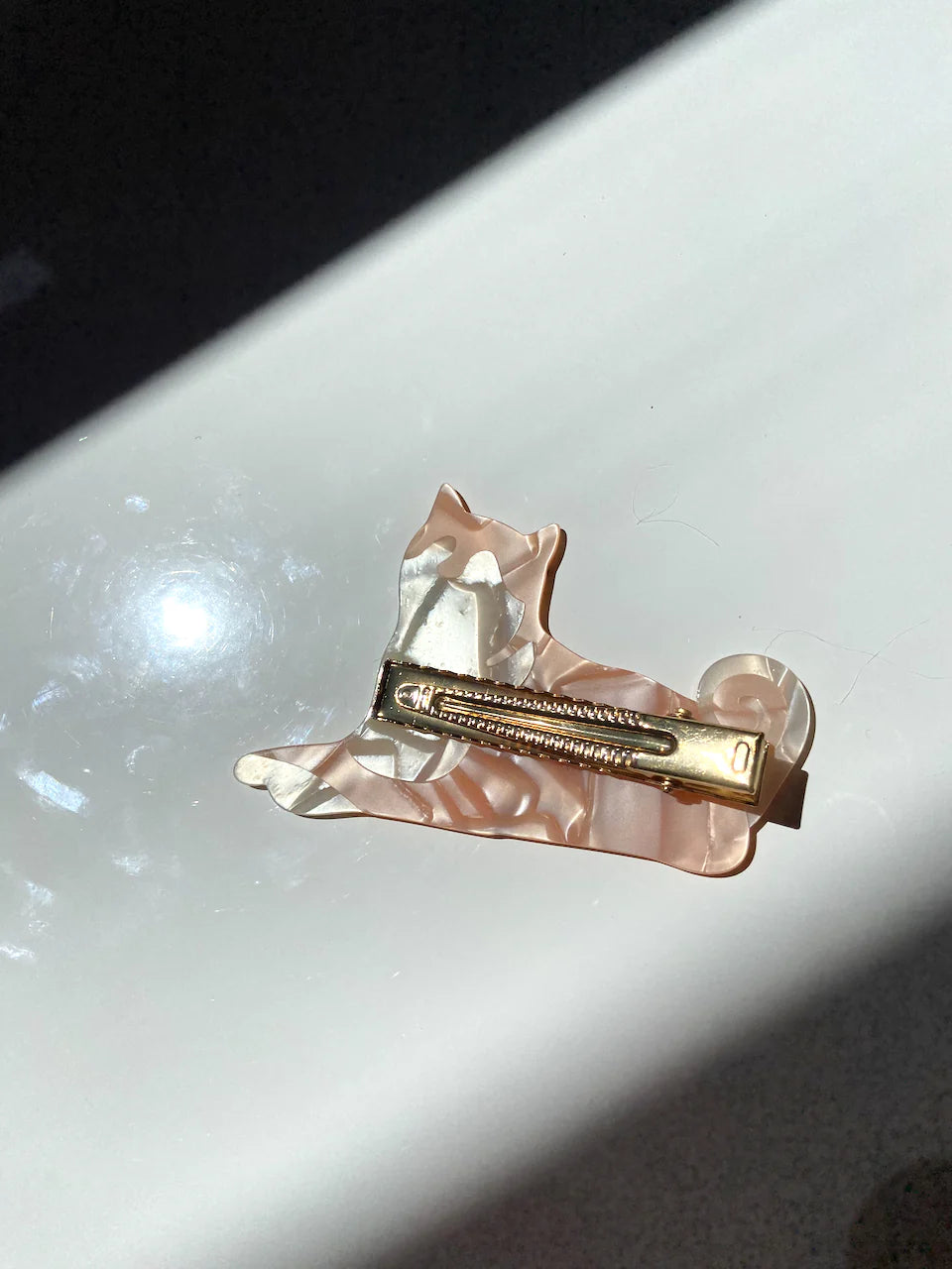 Hand-painted Pug design claw hair clip by Pawsome Pets New York, made from eco-friendly cellulose acetate.