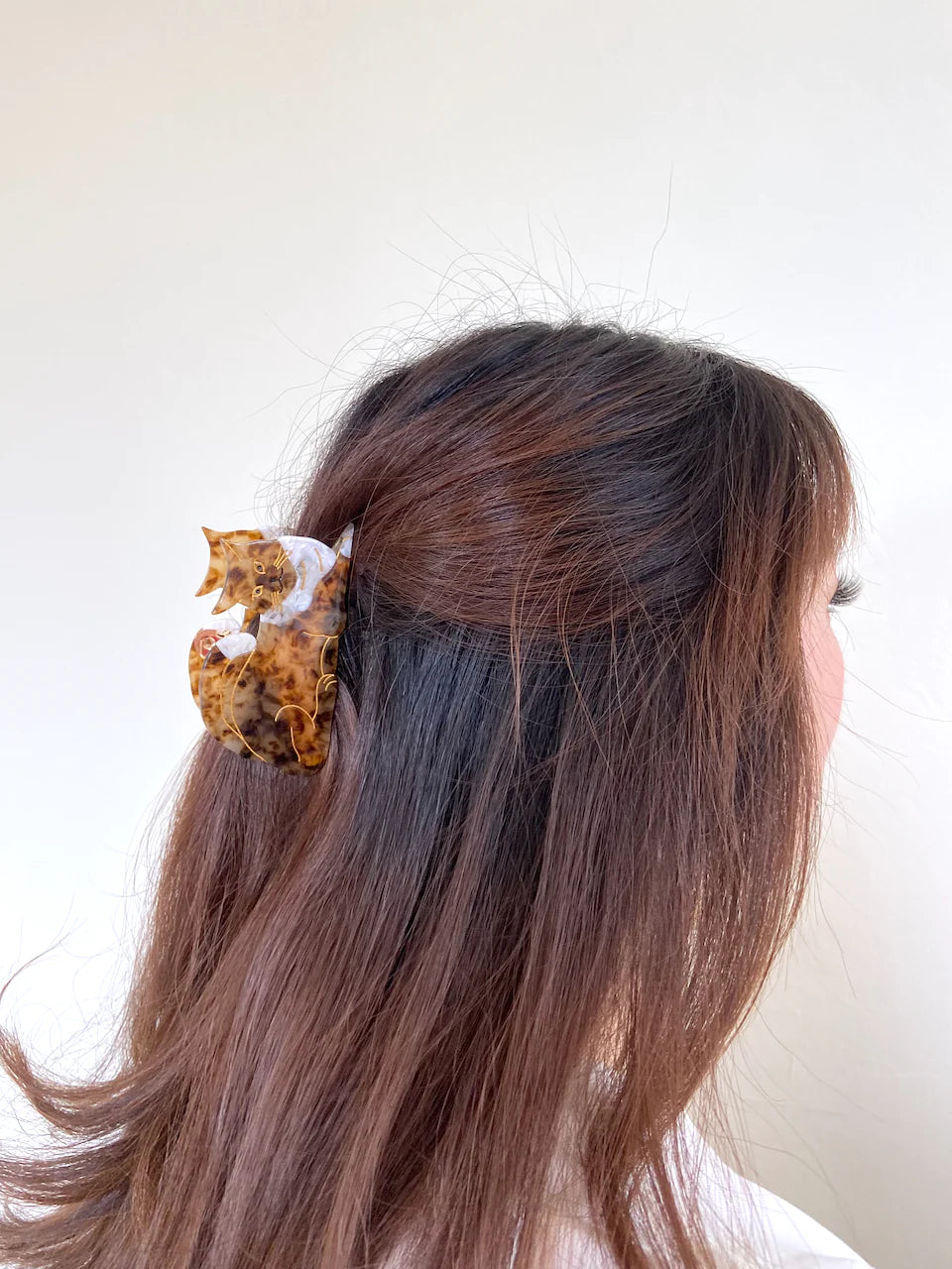 Hand-painted Pug design claw hair clip by Pawsome Pets New York, made from eco-friendly cellulose acetate.