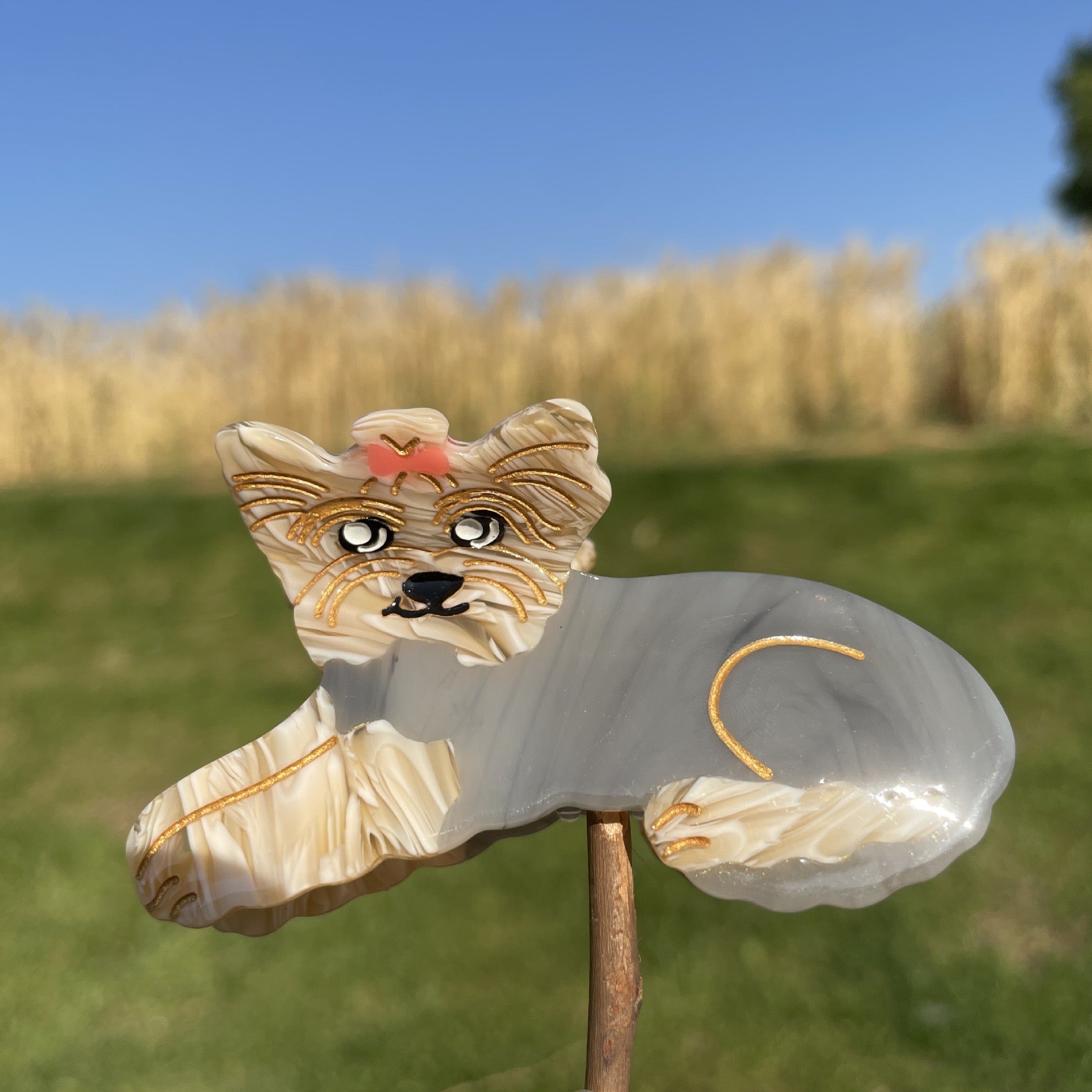 Hand-painted claw hair clip featuring a Pug design, made from eco-friendly cellulose acetate.