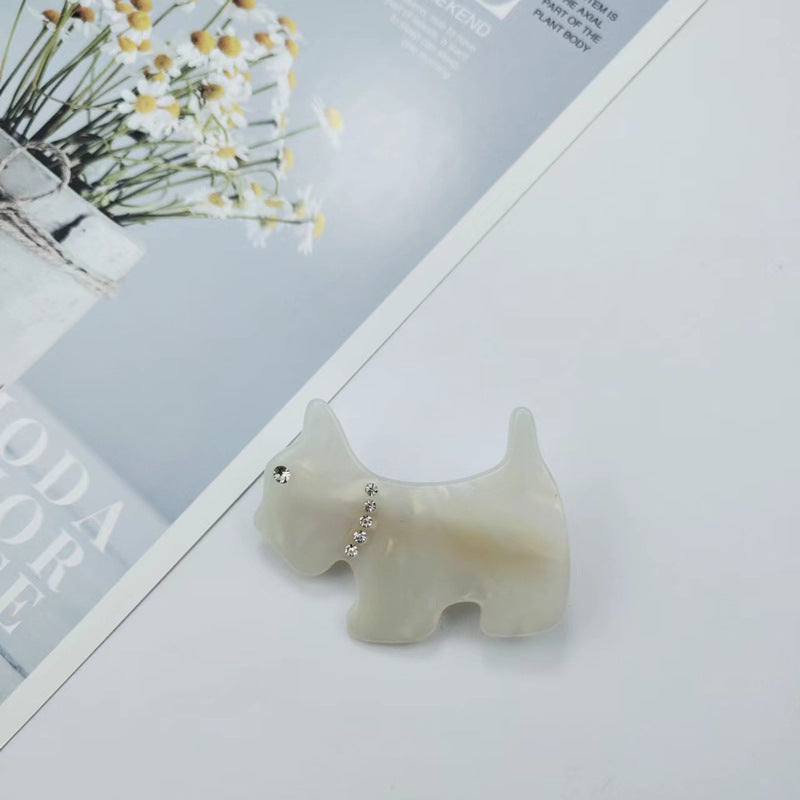 Hand-painted dog hair clip featuring colorful acetate and sparkling rhinestones, designed for dog lovers.