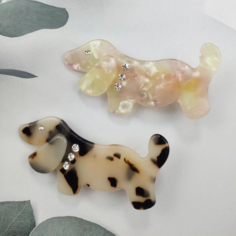 Hand-painted King Charles dog hair clip featuring rhinestones, made from eco-friendly cellulose acetate.