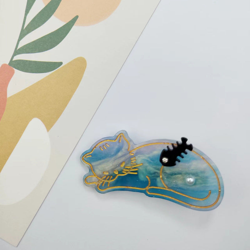 Hand-painted Sleeping Cat Hair Clip featuring rhinestones, made from eco-friendly cellulose acetate.