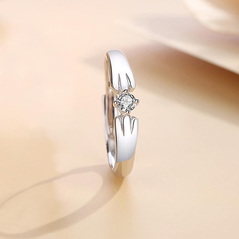 Adjustable sterling silver ring featuring cat ears and paw design, perfect for pet lovers.