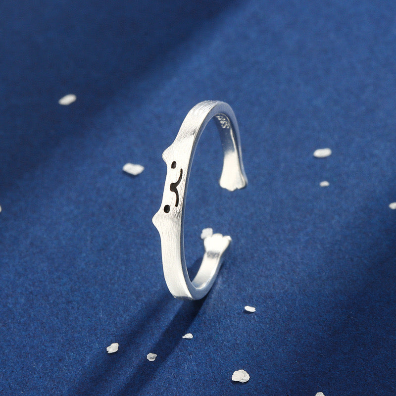 Adjustable sterling silver ring featuring cat ears and paw design, perfect for pet lovers.