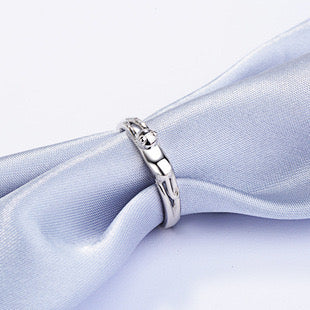 Adjustable sterling silver ring featuring cat ears and paw design, perfect for pet lovers.