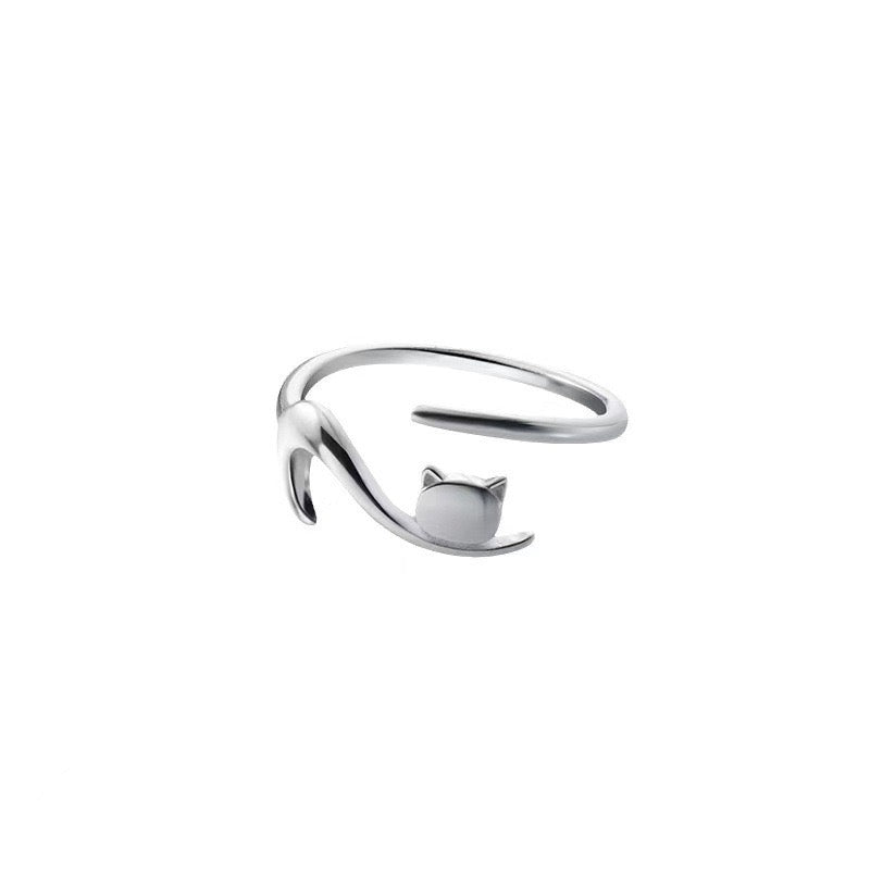 Adjustable sterling silver ring featuring cat ears and paw prints, perfect for pet lovers.