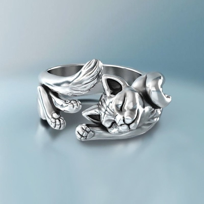 Adjustable sterling silver ring featuring cat ears and paws, perfect for pet lovers.