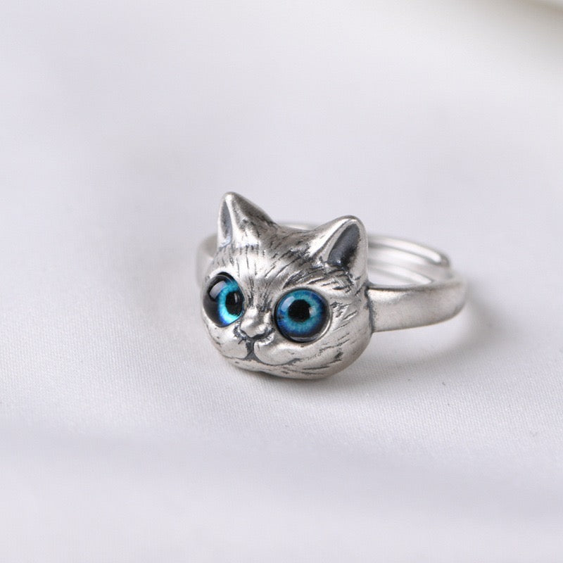 Adjustable sterling silver ring featuring cat ears and paw design, perfect for pet lovers.