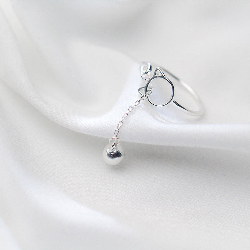 Adjustable sterling silver ring featuring cat ears and paw design, perfect for pet lovers.