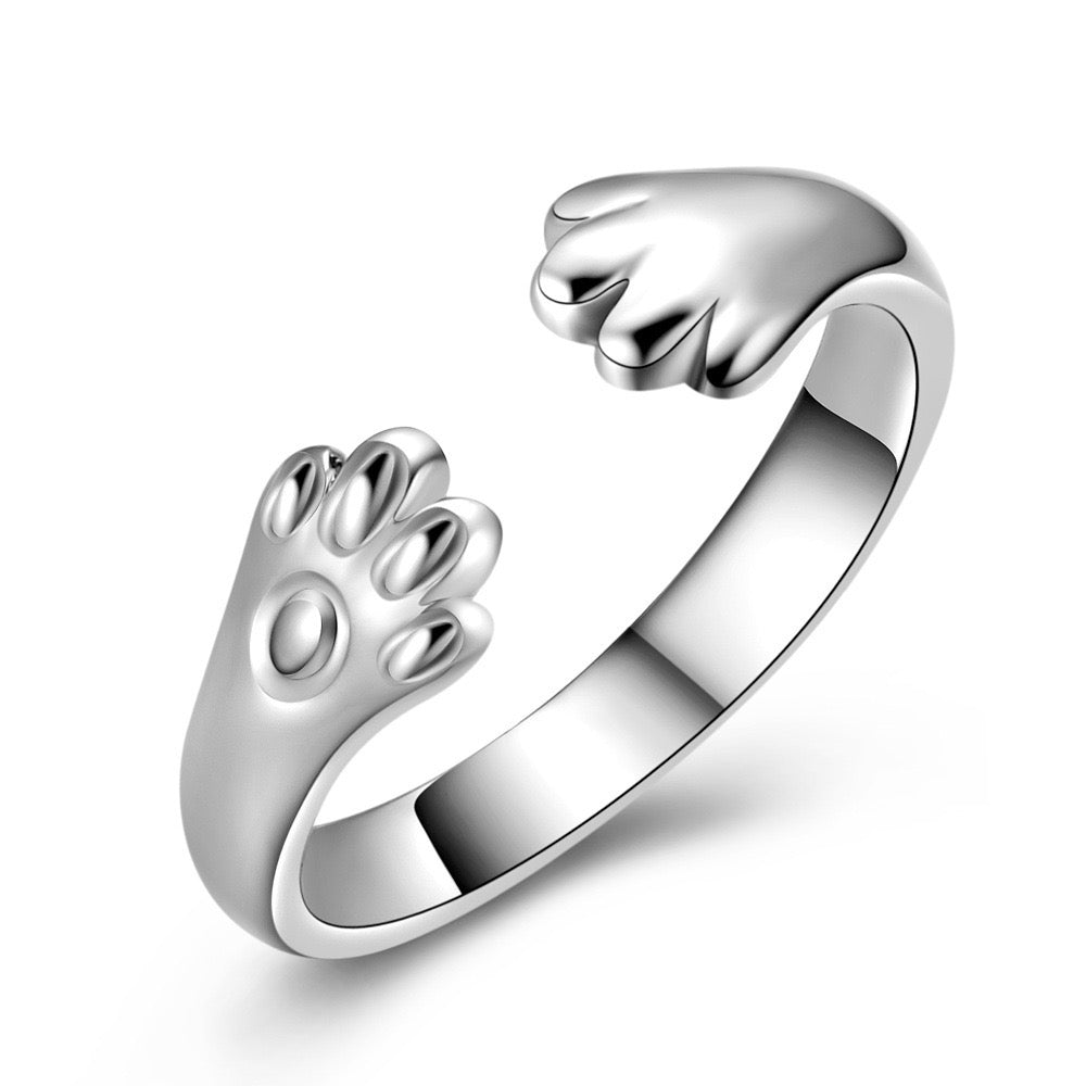 Adjustable sterling silver ring featuring cat ears and paw design, perfect for pet lovers.