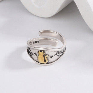 Adjustable sterling silver ring featuring cat ears and paw design, perfect for pet lovers.