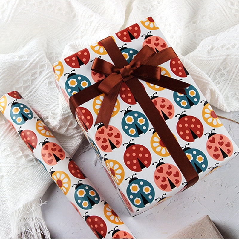 Pawsome Wrapping Roll featuring luxurious FSC certified matte paper, three sheets folded, perfect for eco-friendly gift wrapping.