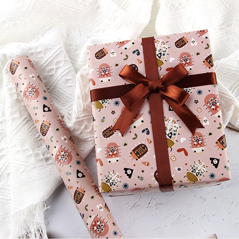 Pawsome Wrapping Roll featuring luxurious FSC certified matte paper, three sheets folded, and eco-friendly packaging.
