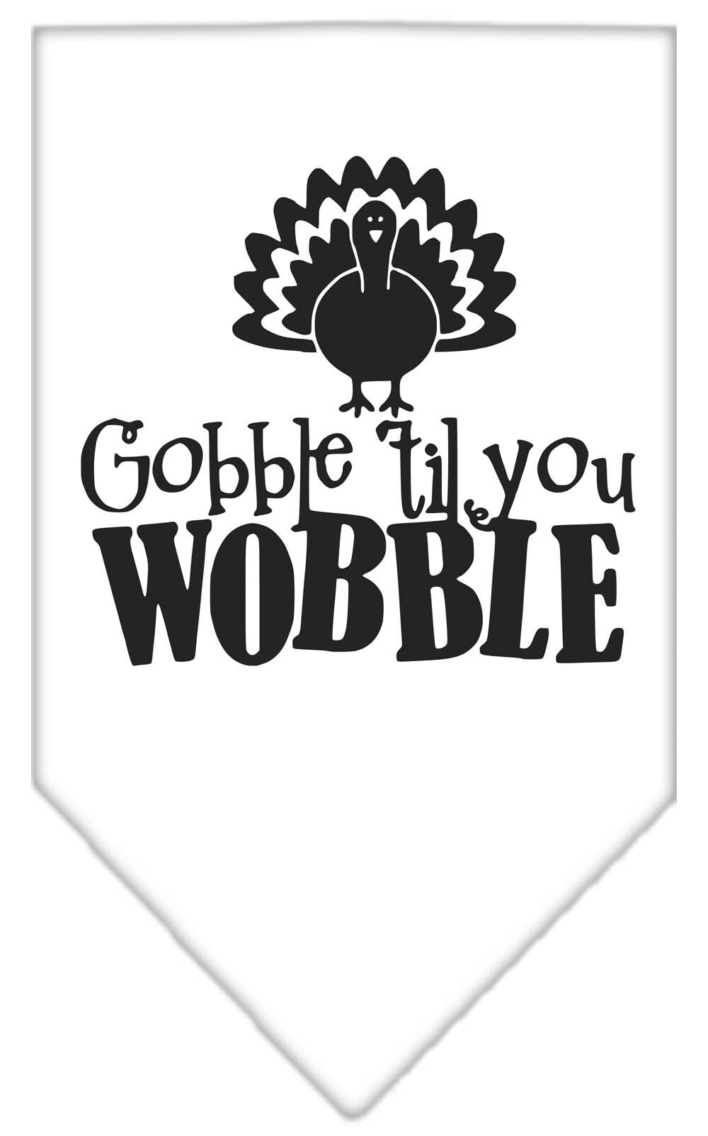 A stylish dog wearing a 'Gobble Til You Wobble' bandana, showcasing its festive design and tie-on style.