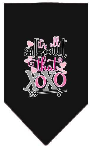 A stylish pet bandana featuring the phrase 'It's All About That XOXO', designed for dogs with a tie-on feature.