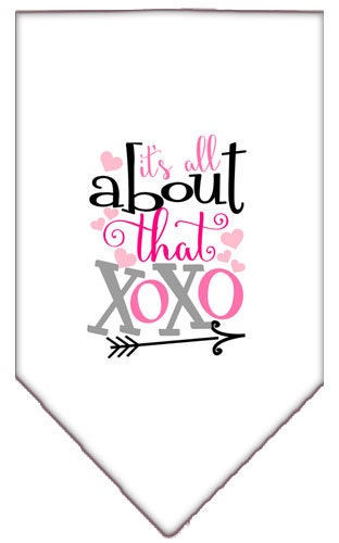 A stylish pet bandana featuring the phrase 'It's All About That XOXO', designed for dogs with a tie-on feature.