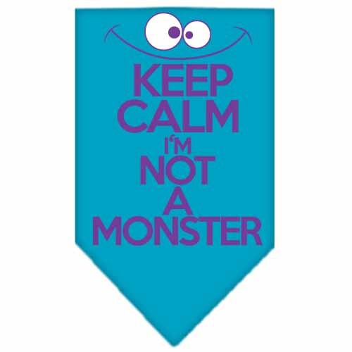 A stylish dog bandana featuring the phrase 'Keep Calm, I'm Not A Monster', designed for comfort and easy tie-on use.