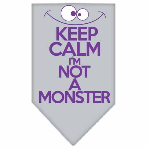 A stylish dog bandana featuring the phrase 'Keep Calm, I'm Not A Monster', designed for comfort and easy tie-on use.