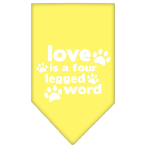 A stylish dog bandana featuring the phrase 'Love Is A Four Legged Word', designed for tie-on use, available in small and large sizes.