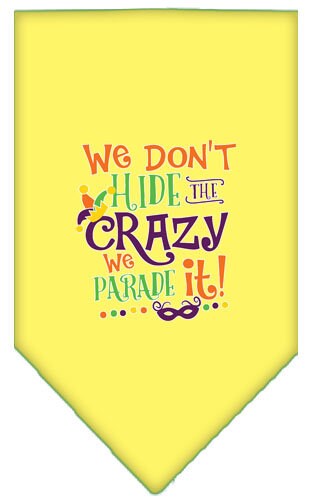 A colorful pet bandana featuring the phrase 'We Don't Hide The Crazy, We Parade It', designed for dogs of all sizes.
