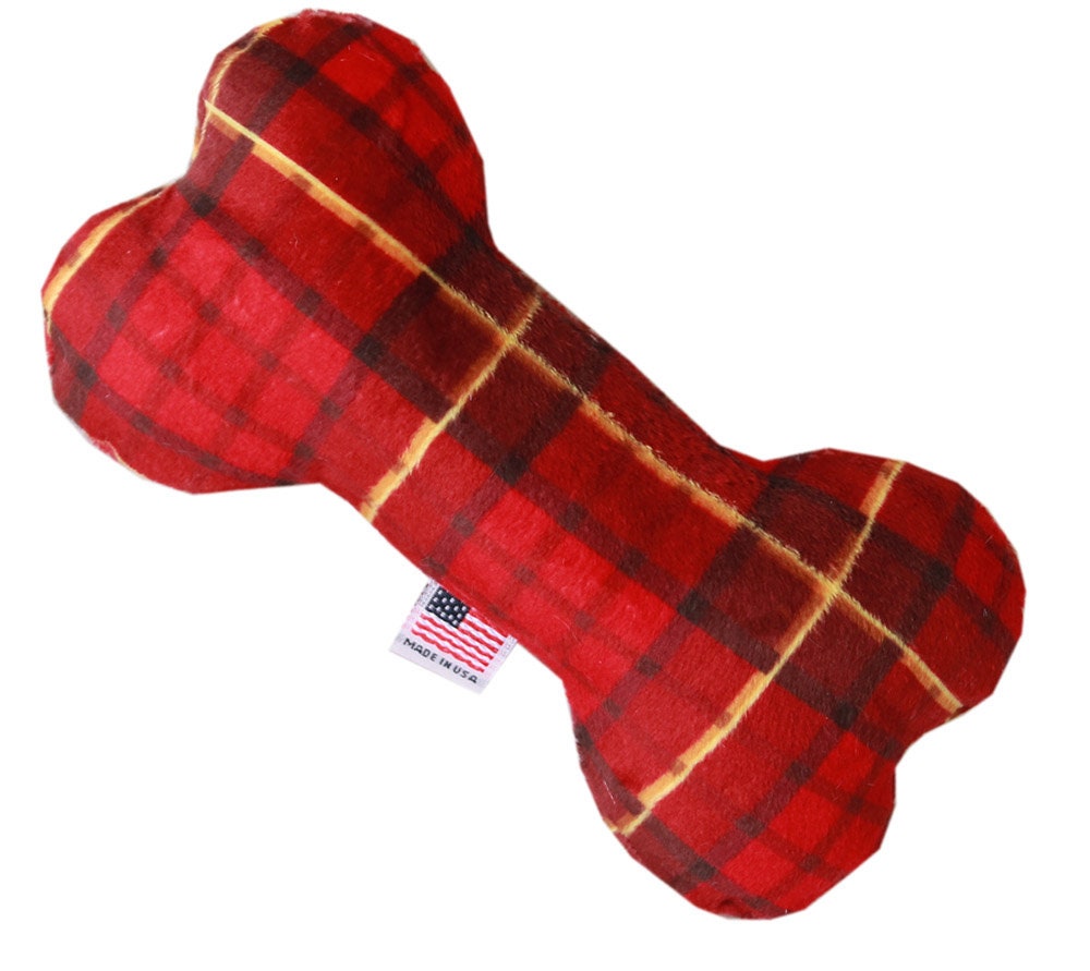 A soft and cuddly 6-inch plush bone toy for dogs, featuring festive patterns from the Happy Holidays Group, perfect for playtime and cuddling.