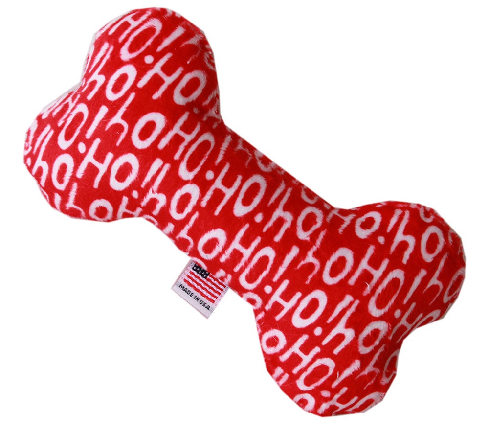 A soft and cuddly 6-inch plush bone toy for dogs, featuring festive patterns from the Happy Holidays Group, perfect for playtime and cuddling.