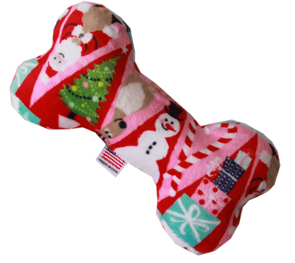 A soft and cuddly 6-inch plush bone toy for dogs, featuring festive patterns from the Happy Holidays Group, perfect for playtime and cuddling.