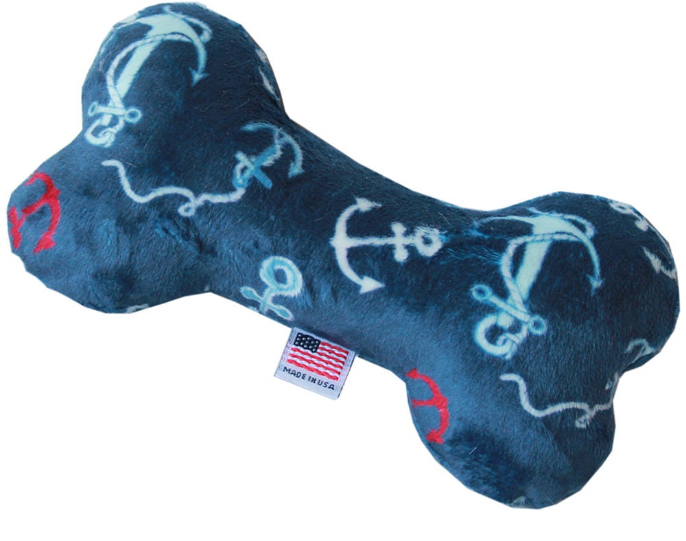 A 6-inch plush bone toy for dogs, featuring a soft texture and available in various colorful patterns, designed for safe play.