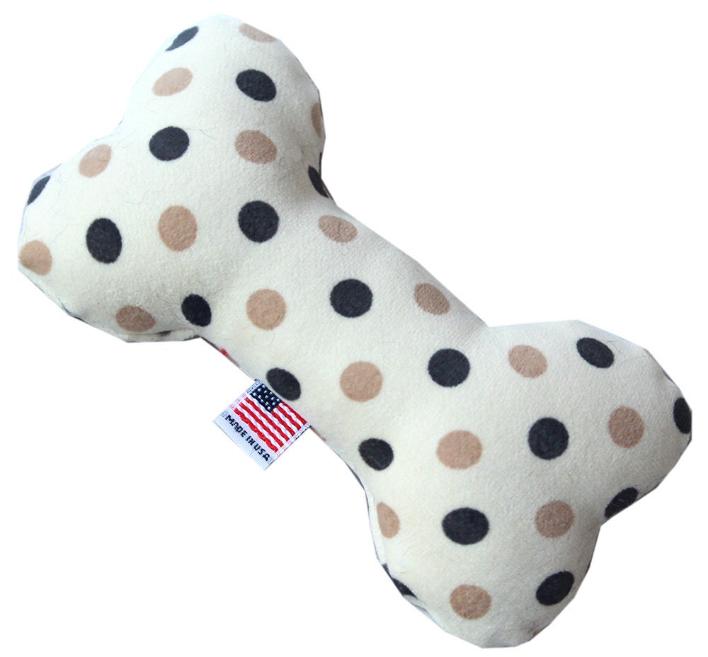 A 6-inch plush bone toy for dogs, featuring a soft texture and available in various colorful patterns, designed for safe play.