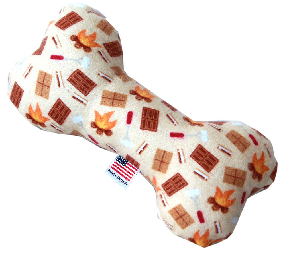 A 6-inch plush bone toy for dogs, featuring a soft texture and available in various colorful patterns, designed for safe play.