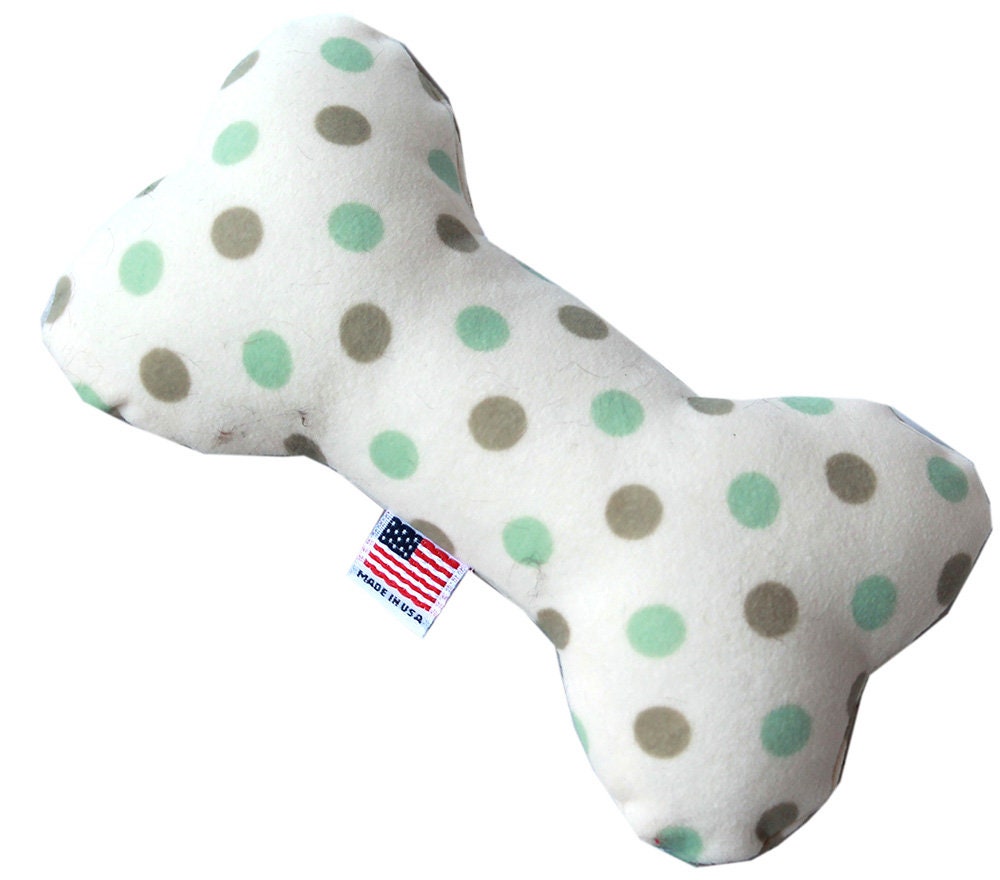 A 6-inch plush bone toy for dogs, featuring a soft texture and available in various colorful patterns, designed for safe play.