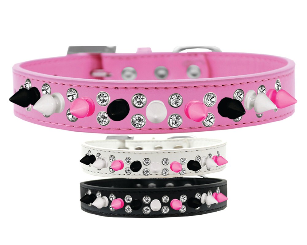 Stylish pet and dog spike collar with double crystals and vibrant pink spikes, showcasing a unique design.
