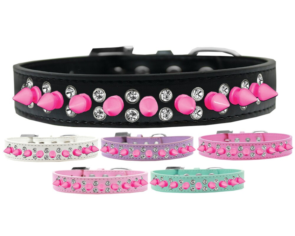 Bright pink spike collar for pets with clear crystals, showcasing a stylish design for dogs and cats.