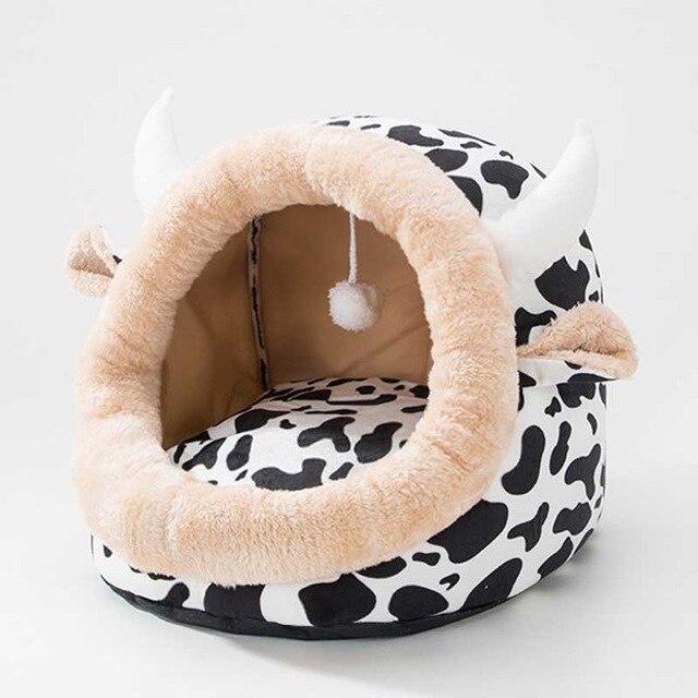Cute unicorn-shaped pet bed for dogs and cats, featuring a soft cotton exterior and a cozy interior, perfect for winter warmth.