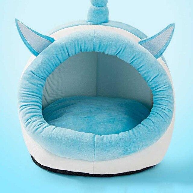 Cute unicorn-shaped pet bed for dogs and cats, featuring a soft cotton exterior and a cozy interior, perfect for winter warmth.
