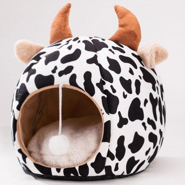 Cute unicorn-shaped pet bed for dogs and cats, featuring a soft cotton exterior and a cozy interior, perfect for winter warmth.